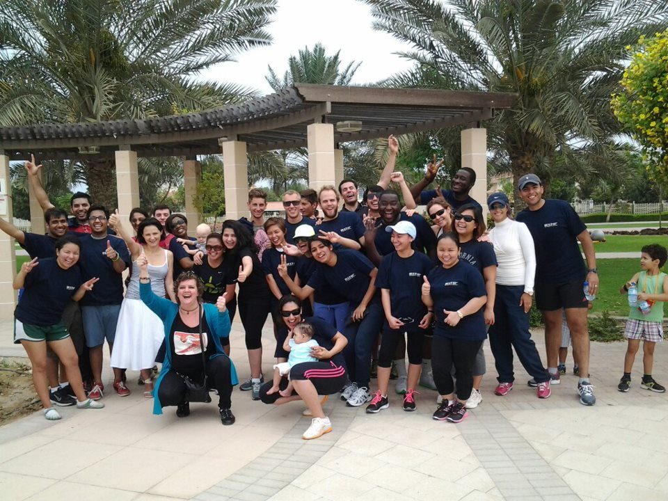 Jo-Dee Walmsley with a group of Hult International Business School students outdoors.