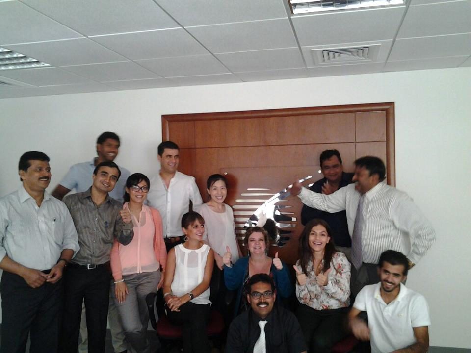 Jo-Dee Walmsley with a Qatar Airways team during a workplace wellbeing session.