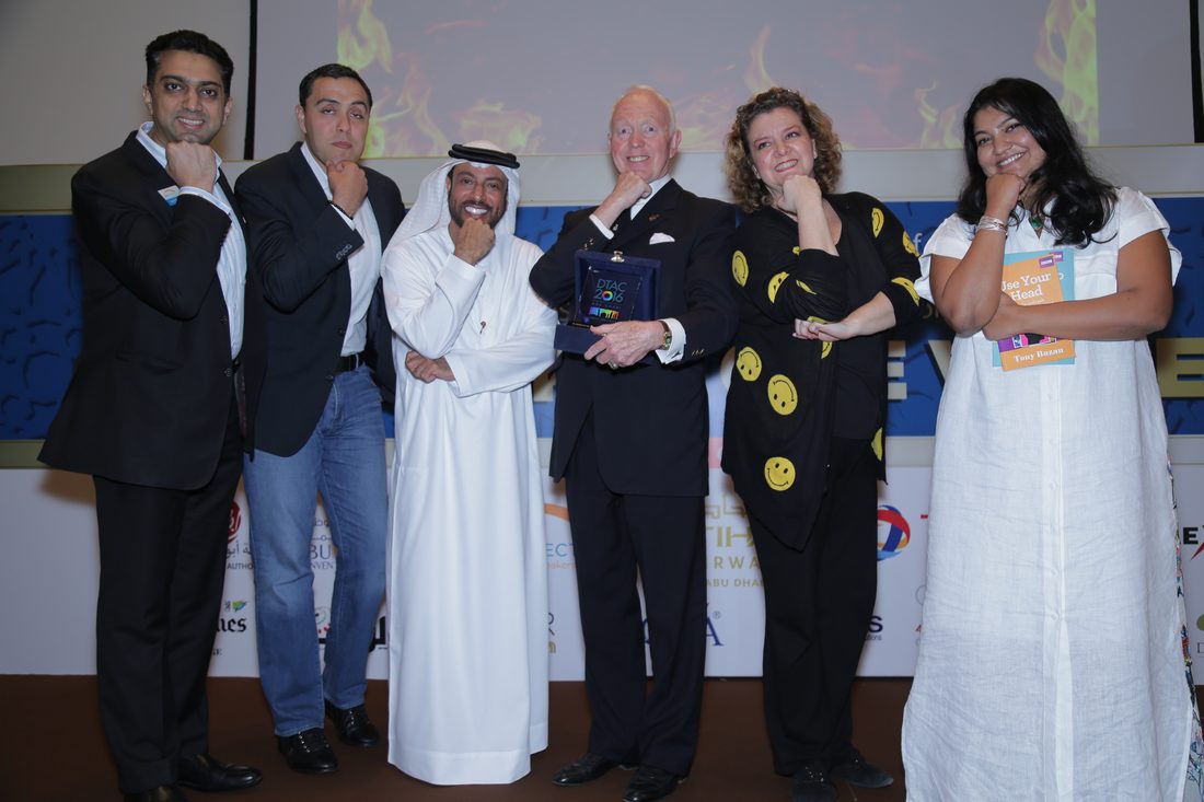 Jo-Dee Walmsley on stage with Tony Buzan at the Golden Gauntlet Award.